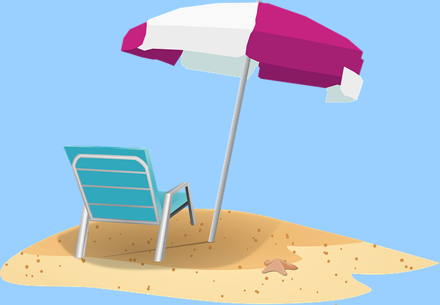 砂浜とパラソルの画像